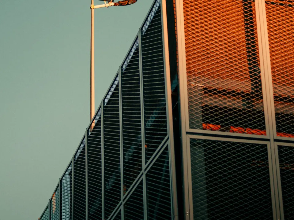 Architectural perforated mesh facade — illustrative image; actual product may vary