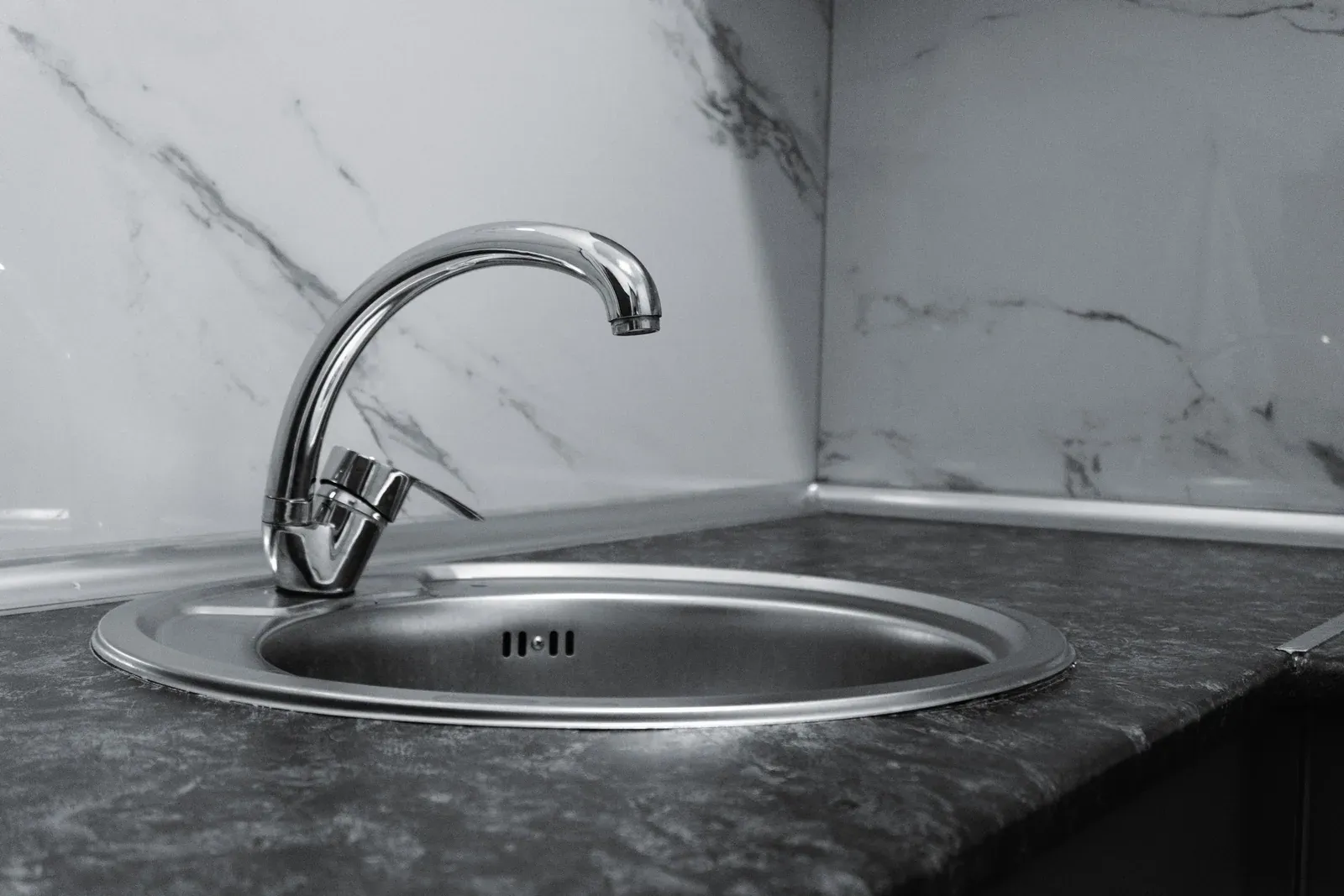 Silver stainless-look kitchen sink — illustrative image; actual product may vary