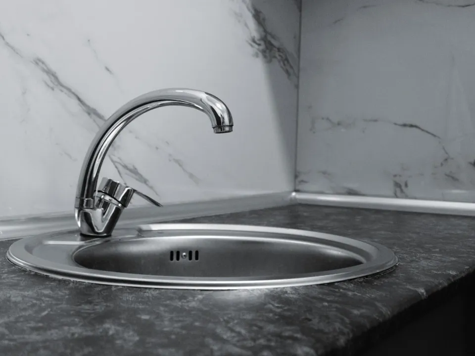 Silver stainless-look kitchen sink — illustrative image; actual product may vary